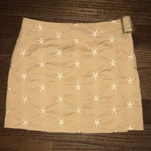 Moschino wrap around mini skirt with stars.